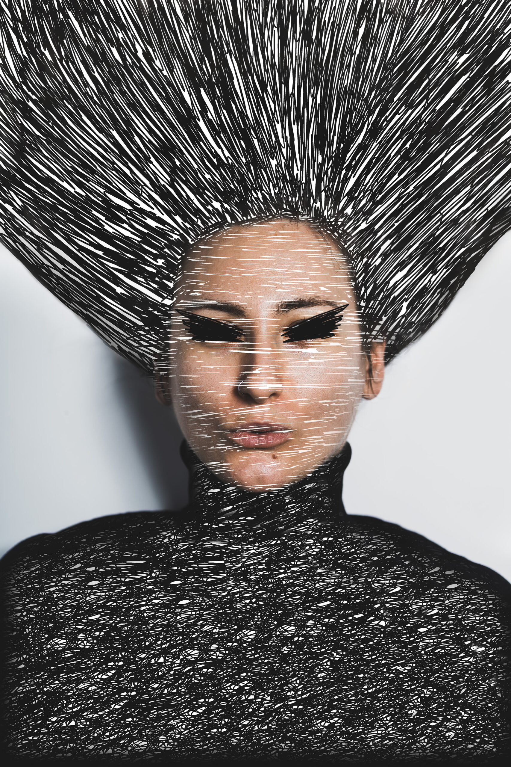 A woman showcasing a striking black and white hairstyle, emphasizing the contrast and texture of her hair.